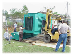 WFEC installs the generator weighing approximately 8,000 pounds, including the fuel tank on which it rests.