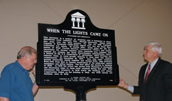 From left, WFEC CEO Bill Rimes and Congressman Allen Boyd display WFEC's new historical marker.
